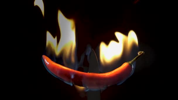 Hot Red Chili Pepper Knife Flames Black Background Spicy Food — Videoclip de stoc