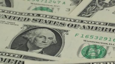 American one dollar paper money pile on desk. US Dollar bills one dollar bills background close-up. Concept of finance and money payment.