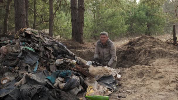 Worker Clears Forest Debris Throws Garbage Out Hole Large Pile — Stock Video