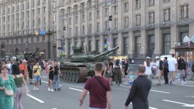 KYIV, UKRAINE - AUG 22, 2022: Destroyed Russian military equipment in the center of Kyiv on Khreshchatyk. People inspect and photograph captured Russian tanks on Ukraines Independence Day.
