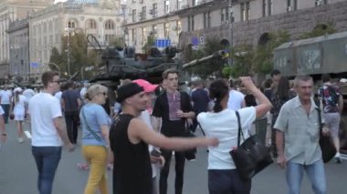 KYIV, UKRAINE - AUG 22, 2022: Destroyed Russian military equipment in the center of Kyiv on Khreshchatyk. People inspect and photograph captured Russian tanks on Ukraines Independence Day.