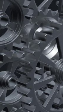 Yakından bakıldığında, mekanik tasarımın karmaşıklığını ve mühendisliğini vurgulayan bir dizi birbirine kenetlenmiş metal vites görülüyor. dikey görüntüler