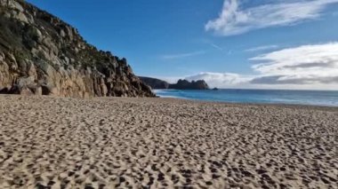 Sunny day in Porthcurno beach Cornwall, England February 2023.