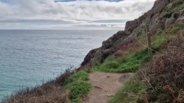 Sunny day in Porthcurno beach Cornwall, England February 2023.