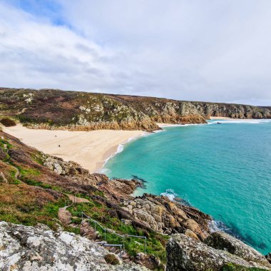 Sunny day in Porthcurno beach Cornwall, England February 2023.