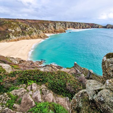 Sunny day in Porthcurno beach Cornwall, England February 2023.