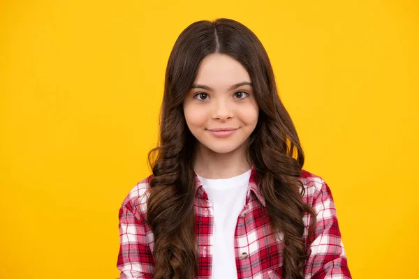 stock image Happy teenager, positive and smiling emotions of teen girl. Portrait of beautiful happy smiling teenage girl on yellow studio background