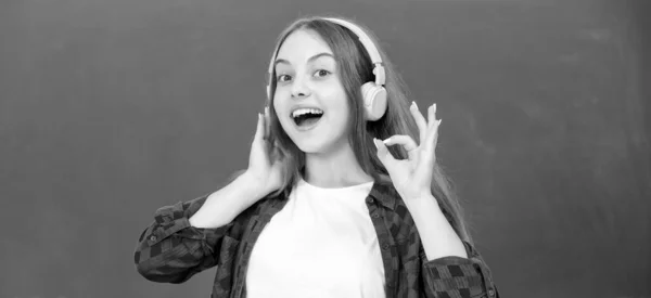 Cheerful Child Listen Music Headphones Blackboard Ebook — ストック写真
