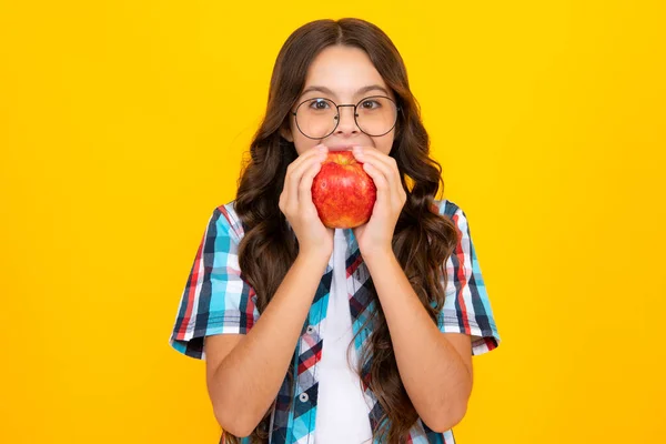 stock image Teenager child girl biting tasty green apple