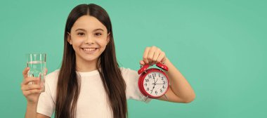 healthy childhood lifestyle. time to drink water. water balance in body. Banner of child girl with glass of water, studio portrait with copy space