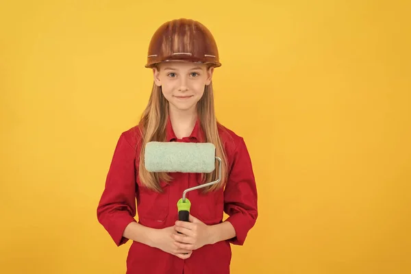 Smiling Teen Child Builder Hard Hat Paint Roller Yellow Wall — Stockfoto