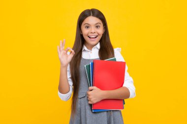 School child with book. Learning and education. Happy schoolgirl face, positive and smiling emotions