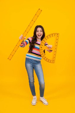 Amazed teenager. Back to school. Teenager school girl on isolated background. School supplies. Excited teen schoolgirl