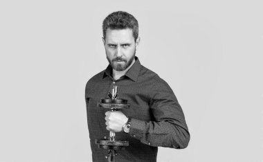 Güçlüdür. Patron güç ve otorite göster. Dambılı bir iş adamı. Spor gücü. Erkeklerin gücü. Başarılı bir sporcu. İş başarısı. Koltuk değnekleriyle eğitime hazır bir adam..