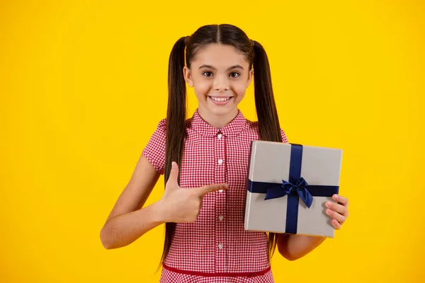 stock image Happy teenager, positive and smiling emotions of teen girl. Child 12-14 years old with gift on isolated background. Birthday, holiday concept. Teenager hold present box