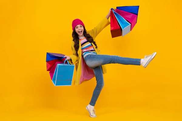 stock image Teenager hold shopping bag enjoying sale. Child girl is ready to go shopping. Winter shopping sale. Happy teenager, positive and smiling emotions of teen girl