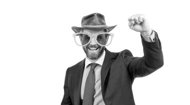Happy man wear party glasses and cowboy hat in formalwear make winner gesture isolated on white, celebration.