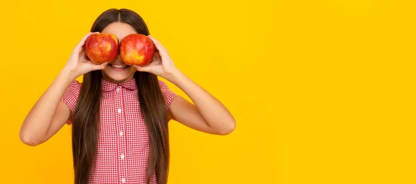 stock image vitamin and dieting. child eating healthy food. childhood health. natural organic fresh apple. Child girl portrait with apple, horizontal poster. Banner header with copy space