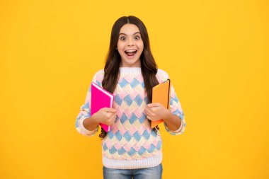 Excited face. Back to school. Portrait of teenage school girl with books. Children school and education concept. Schoolgirl student. Amazed expression, cheerful and glad