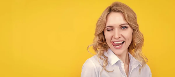 Glad Blonde Woman Curly Hair Licking Lips Tongue Yellow Background —  Fotos de Stock