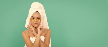 teen girl in shower towel with golden patch. cosmetology. Cosmetics and skin care for teenager child, poster design. Beauty kid girl banner with copy space