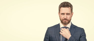 Adding finishing touch to his attire. Man fix necktie. Fashion accessory. Accessory makes outfit. Man face portrait, banner with copy space