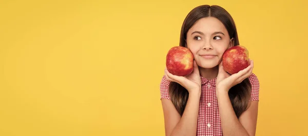 stock image childhood health. natural organic fresh apple. healthy life. diet and kid beauty. Child girl portrait with apple, horizontal poster. Banner header with copy space