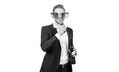 Happy guy conferencier in funny glasses and formal suit give toast with wine to microphone isolated on white, toastmaster.