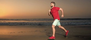Man running and jumping, banner with copy space. athletic man runner running on sunset summer beach, stamina
