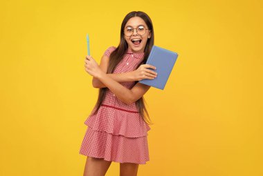 Amazed teen girl. Teenager school girl study with books. Learning knowledge and kids education concept. Excited expression, cheerful and glad