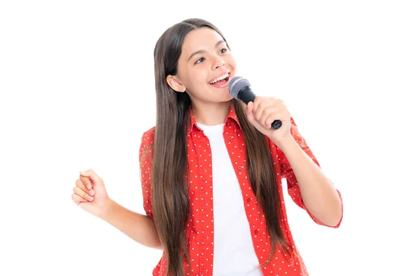 stock image Child girl holding wireless microphone for karaoke singing or talk and speaker on white background isolated with space. Portrait of emotional amazed excited teen girl. Portrait of smiling teenage