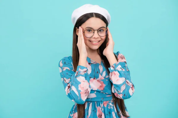 Happy face, positive and smiling emotions of teenager girl. Teenager child with poor eyesight wear eyeglasses, looking squinting. Kids glasses. Happy teenager, positive and smiling emotions
