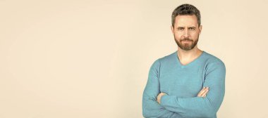 Man face portrait, banner with copy space. handsome mature man with beard on grey background, style