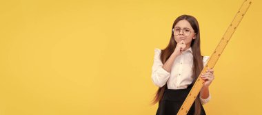 trigonometry stationery. measuring and sizing. education for child. mathematics. Portrait of schoolgirl student, studio banner header. School child face, copyspace