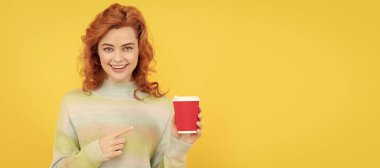 Woman with coffee cup. woman pointing finger on plastic cup. good morning. express happiness. positive emotions. Woman isolated face portrait, banner with copy space