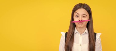 Knowledge day. Winking girl hold pen as mustache. School education. Knowledge day. . Portrait of school girl student, studio banner header. School child pupil face, copy space