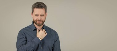 Casual appearance without having to don a tie. Bearded man wear shirt. Wearing smart casual. Man face portrait, banner with copy space