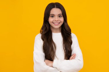 Happy face, positive and smiling emotions of teenager girl. Cute preteen girl head shot. Child portrait on isolated background. Beautiful teenager face