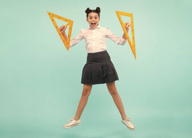 Amazed teenager. Back to school. Teenager school girl on isolated background. School supplies. Excited teen schoolgirl