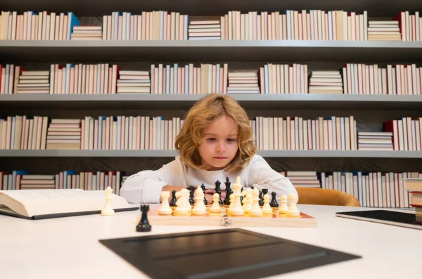 Chess school. Child think or plan about chess game, kids education concept. Intelligent, smart and clever school kids
