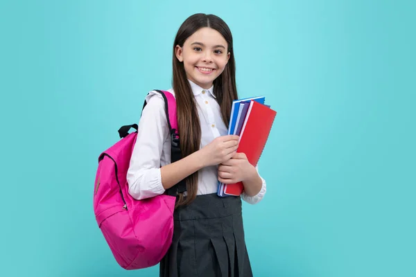 stock image School teenager child girl 12, 13, 14 years old with school bag book and copybook. Teenager schoolgirl student, isolated background. Learning and knowledge