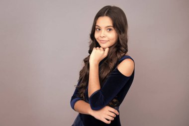 Happy face, positive and smiling emotions of teenager girl. Cute preteen girl head shot. Child portrait on isolated background. Beautiful teenager face