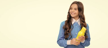 Satisfy your appetite. Happy kid hold bottle isolated on white. Yogurt snack. Appetite control. Horizontal poster of isolated child face, banner header, copy space