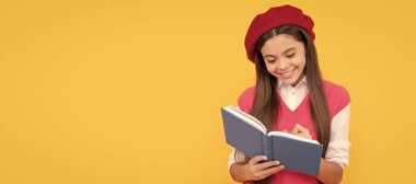 happy teen school girl in french beret making notes in planner notepad or notebook, writing. Banner of school girl student. Schoolgirl pupil portrait with copy space