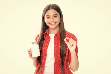Child hold antibiotics. Healthcare, vitamins and pills. Pharmacy drug store. Teen with illness symptoms. Portrait of happy smiling teenage child girl