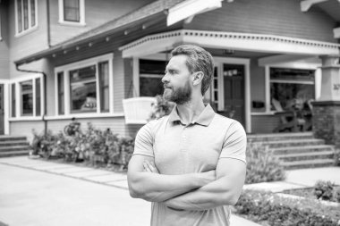 real estate agent sell property. realtor in suburb neighborhood. man purchasing house for investment purpose. property insurance services. ownership. confident american settlement agent.