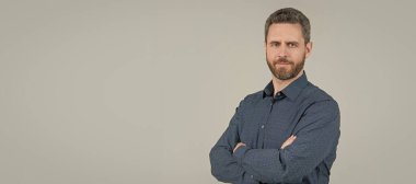 You can always be confident. Confident man keep arms crossed grey background. Casual style. Man face portrait, banner with copy space