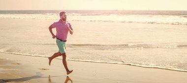 Man running and jumping, banner with copy space. energetic summer. runner feel freedom. enjoying the morning. sport athlete run fast