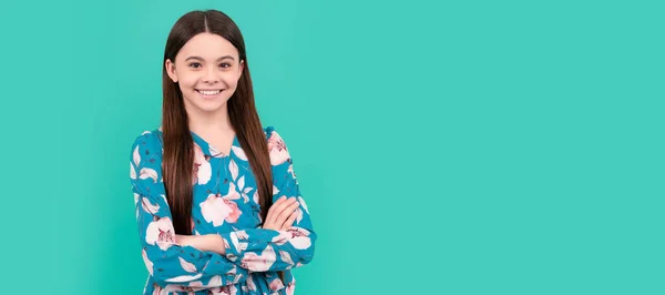 Confident about the future. Confident girl blue background. Happy child smile keeping arms crossed. Child face, horizontal poster, teenager girl isolated portrait, banner with copy space