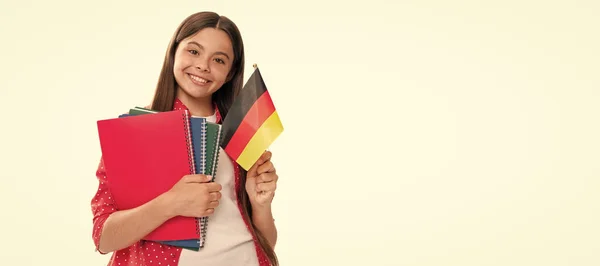 happy kid hold german flag and school copybook for studying isolated on white, foreign language. Banner of school girl student. Schoolgirl pupil portrait with copy space